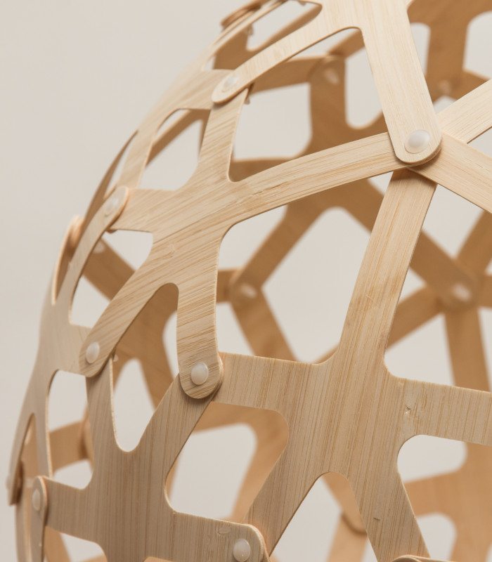 Close-up of the Coral pendant in natural bamboo plywood